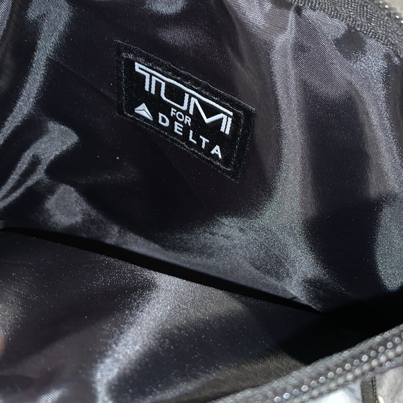 Tumi Purple and Gray Travel Pouches with Socks and sleep masks - Picture 6 of 6